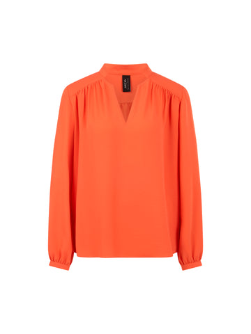 Fließende Bluse mit Schmuckknopf